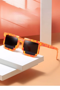 Detail view of pixel style sunglasses with orange checkered frame on minimalist white stairs