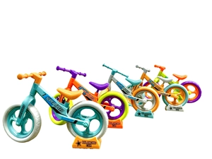 Detail of colorful mini balancing car toys on stands with Super Speed logo graphics