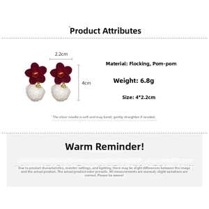 Detail showing red flocked flower earrings with white fur balls and size specifications