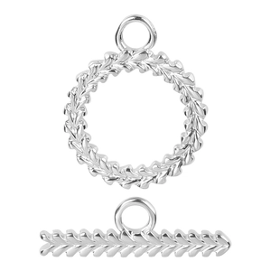 Detailed macro view of silver OT toggle clasp with engraved leaf patterns for jewelry