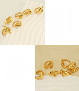 Detailed macro view of 18k gold plated stainless steel rings with wavy fluid designs