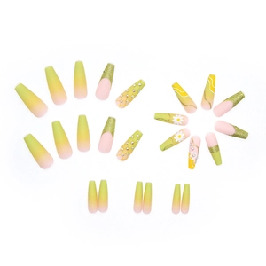 Long ballerina press-on nails with yellow daisy floral design and sparkly rhinestones