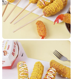 Close-up of realistic cheese corn dog model with breadcrumbs and condiment drizzles