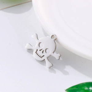 Polished silver skull pendant necklace with pirate flag detail on white surface
