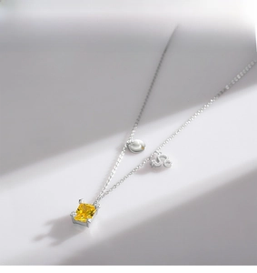 Detailed macro of S925 sterling silver Leo necklace with yellow emerald-cut zircon pendant