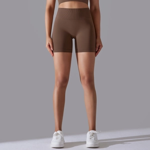 Close-up of deep brown seamless high-waisted yoga shorts with ribbed waistband texture