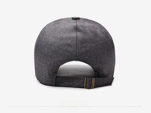 Close-up of gray fabric baseball cap back with adjustable bronze metal buckle
