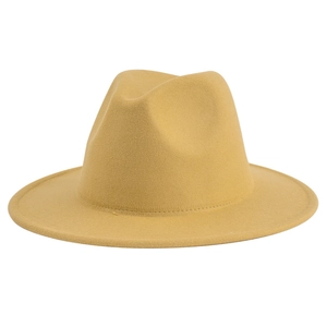 Detailed close-up of mustard yellow wool felt texture on a flat brim fedora hat