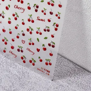 Vue macro de stickers 3D gaufrés pour ongles cerise avec motifs de fruits et textures