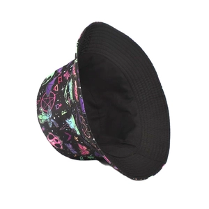 Detail of neon bucket hat with celestial patterns and butterflies on black canvas