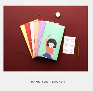 Detail of colorful Teacher's Day paper gift bags with Thank You stickers and cartoon motifs