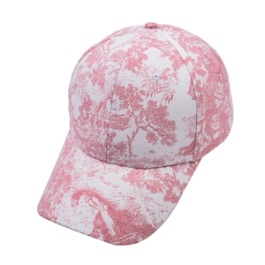 Detail of pink Toile de Jouy floral print on a classic cotton baseball cap for women