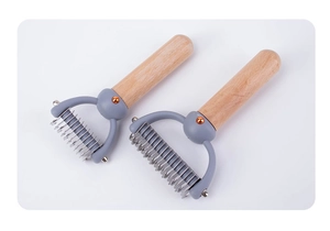 Macro detail of beech wood pet grooming rake with stainless steel de-matting blades
