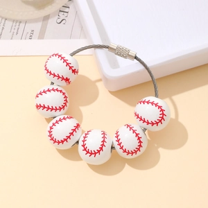 Macro shot of baseball bead bracelet with steel wire ring and metal screw clasp closure