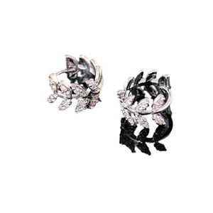 Silver olive branch hoop earrings with marquise-cut zircons on a reflective black base