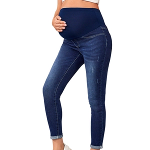 Detail of high waist maternity jeans with elastic support band for pregnant women