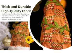 Close-up of harvest gnome hat with orange plaid fabric and floral detail