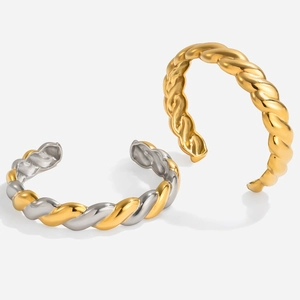 Close-up of twisted rope texture and polished finish on 18K gold stainless steel bangles