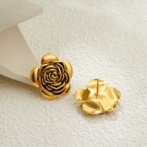 Elegant 18K gold rose flower stud earrings with a matte metallic texture on white stone