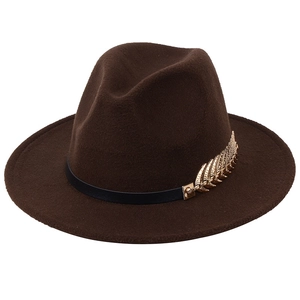 Brown wool felt fedora hat with black band and gold feather accent on white background