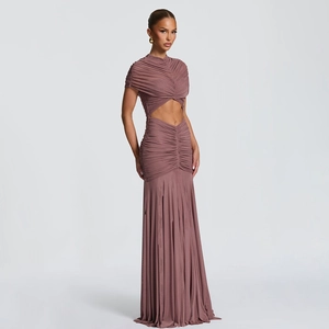 Detail of ruched cutout design and mermaid hem on a dark pink bodycon evening dress