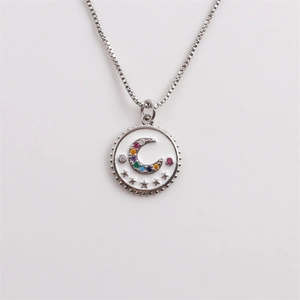 Silver rainbow moon and stars pendant necklace with white enamel and colorful crystals