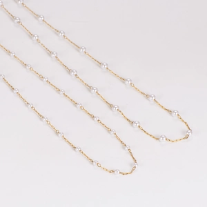 Elegant gold chain necklace with white pearls in classic tin cup design for women
