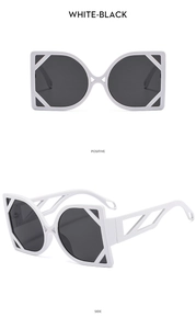 Detailed front and side views of oversized white cat-eye sunglasses with dark lenses