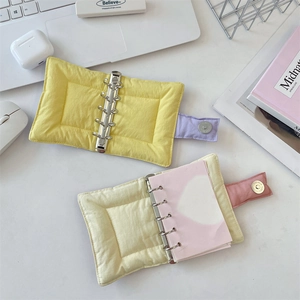 Detail of 6-ring quilted fabric binder notebooks with magnetic clasp and metal rings