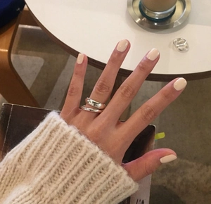 Polished S925 sterling silver minimalist rings set worn in a lifestyle coffee setting