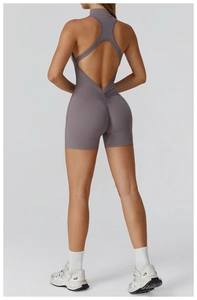 Detailed back view of grey-purple high-stretch yoga bodysuit with open back and ruched detail
