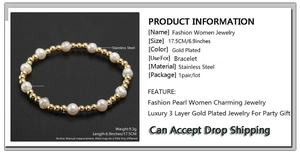 Close-up of 6mm freshwater pearls and 3mm gold-plated stainless steel beads on elastic bracelet