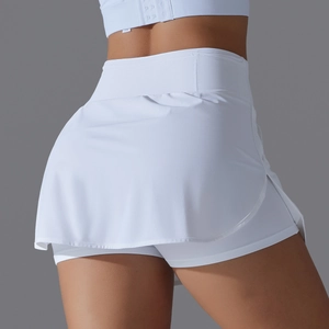 Rear view of white high-waisted tennis skort showing the curved hem and layered design