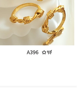 Detailed view of irregular geometric twisted gold rings with natural freshwater pearls