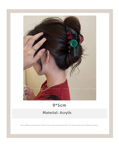 Detail view of a 9x5cm acrylic hair claw clip shown from behind on model's hair