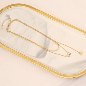 Double-layered gold necklace with mother of pearl butterfly pendant and paperclip chain