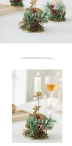 Detail of golden reindeer candle holder with pine cones and berries for festive decor