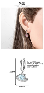 Detail view of Saturn hoop earrings with pink heart zircon and size specifications