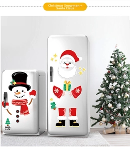 Detailed view of festive Santa and Snowman magnetic fridge stickers on white appliances