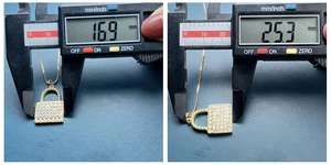 Macro shot showing shell zircon padlock pendant dimensions being measured with digital caliper