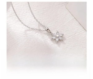Detailed close-up of a titanium steel flower necklace with marquise-cut zircon petals