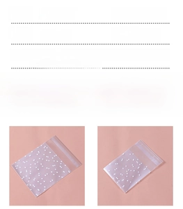 Close-up of frosted self-adhesive gift bags with white polka dots for cookies