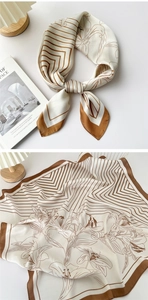 Detail of silk square scarf featuring elegant stripes and lily floral pattern textures
