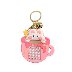 Pink rabbit calculator keychain with silicone bunny in cup and small bell charm