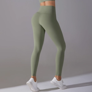 Detail of high-waist avocado green yoga leggings showing body-shaping fit and soft texture
