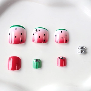 Summer watermelon press-on toenails with green French tips and sparkling rhinestones