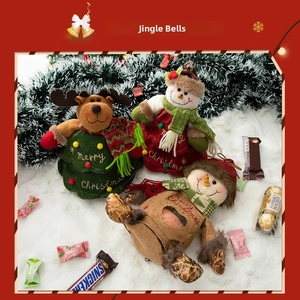 Close-up of plush reindeer and snowman Christmas gift bags with Merry Christmas embroidery