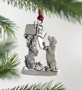 Close-up of metal golden retriever puppy Christmas ornament on rustic mailbox detail