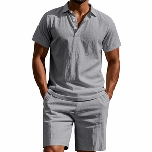 Detail of grey men's linen polo shirt and shorts set showing breathable fabric texture