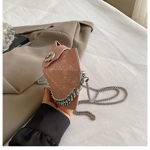 Pink geometric crossbody bag with delicate lace patterns and a gold chain strap